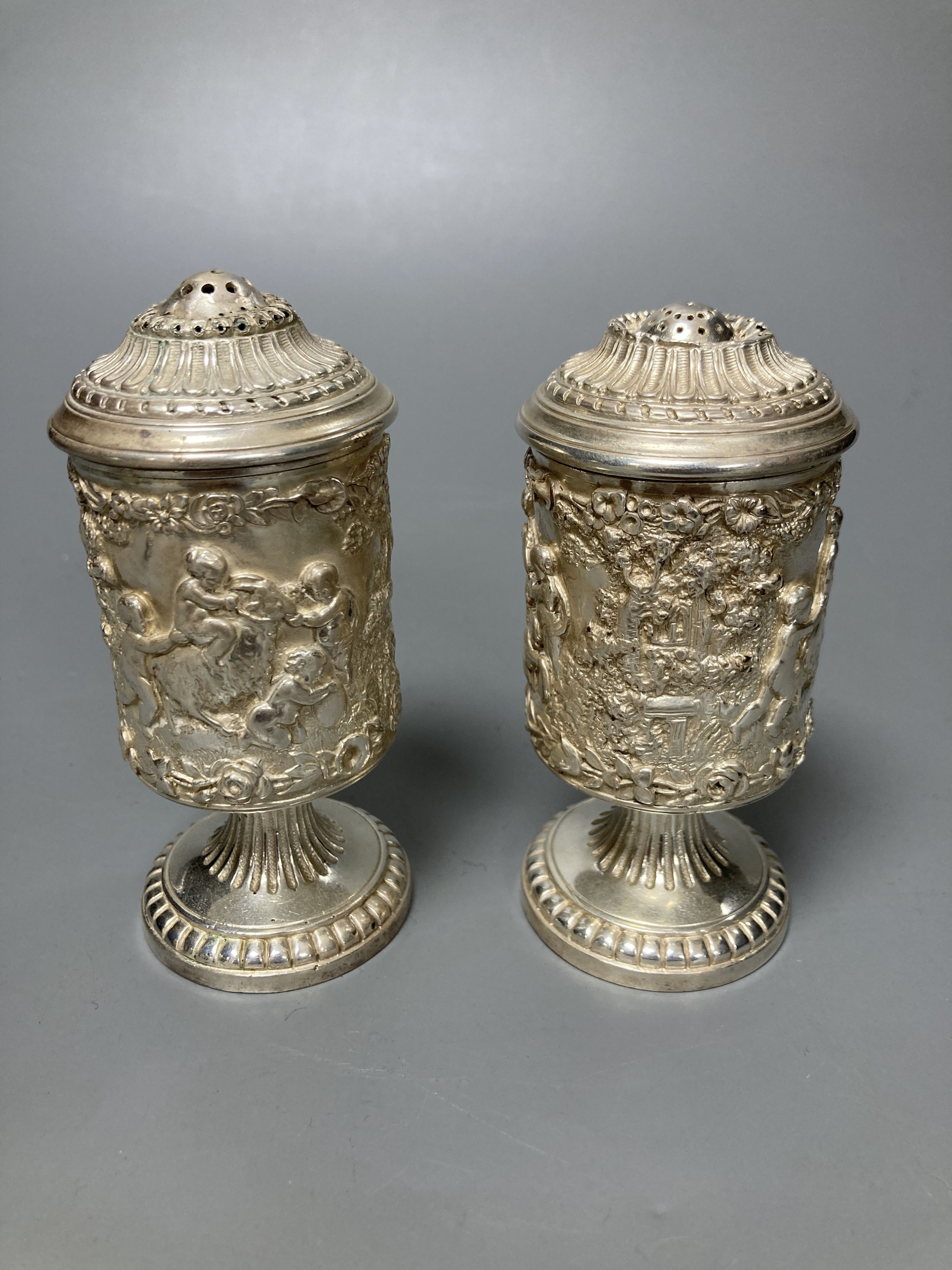 A three piece silver plated cruet set, by Elkington and co-, mustard pot and cover 11.5 cm high